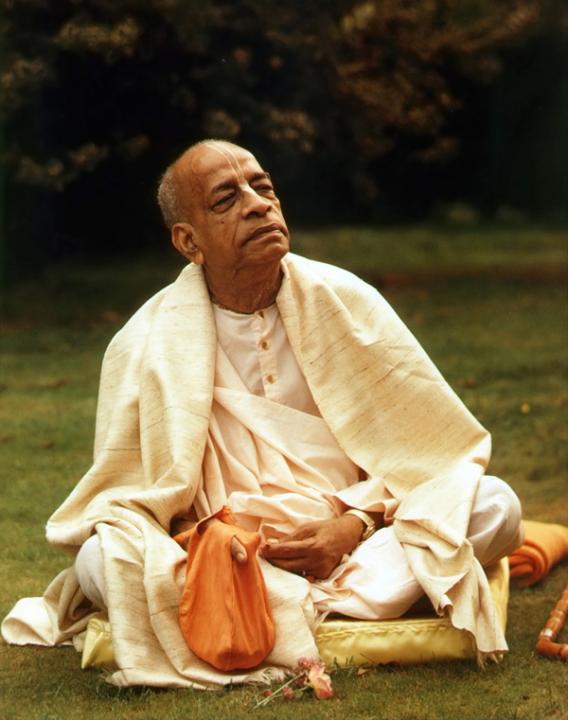 His Divine Grace A. C. Bhaktivedanta Swami Prabhupāda chanting on japa beads.